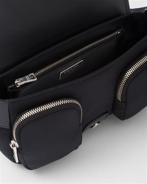 PRADA Pocket Nylon and Brushed Leather Bag in Black.